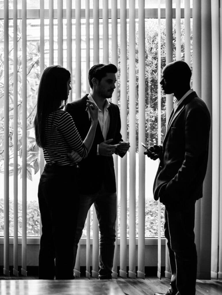 Silhouettes of businesspeople interacting background business ce